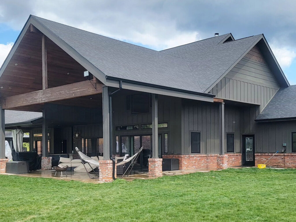 Pressure washing of cement walkways and driveways at a residential property in Post Falls, ID by Bullseye Wash Systems.