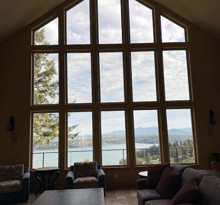 Professional window cleaning services for luxury custom home with tall windows in Fernan Mountain, Coeur d'Alene, ID by Bullseye Wash Systems