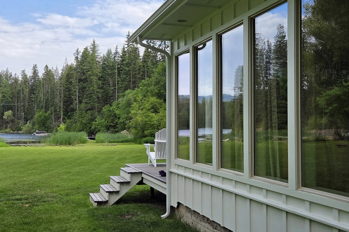 Exterior window cleaning for a lake house in Spokane Valley, WA, performed by Bullseye Wash Systems to prepare for the busy rental season.