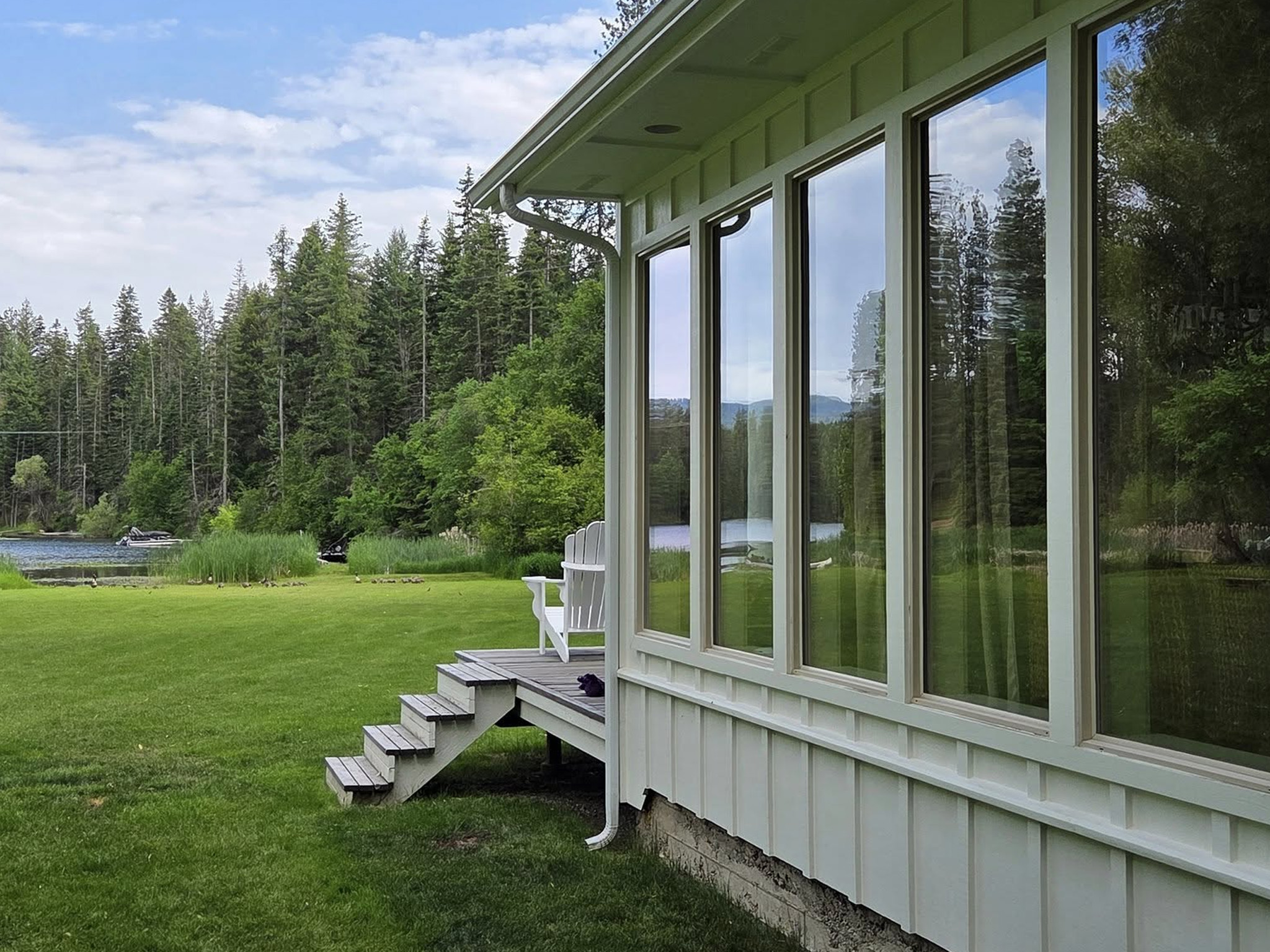 Exterior window cleaning for a lake house in Spokane Valley, WA, performed by Bullseye Wash Systems to prepare for the busy rental season.