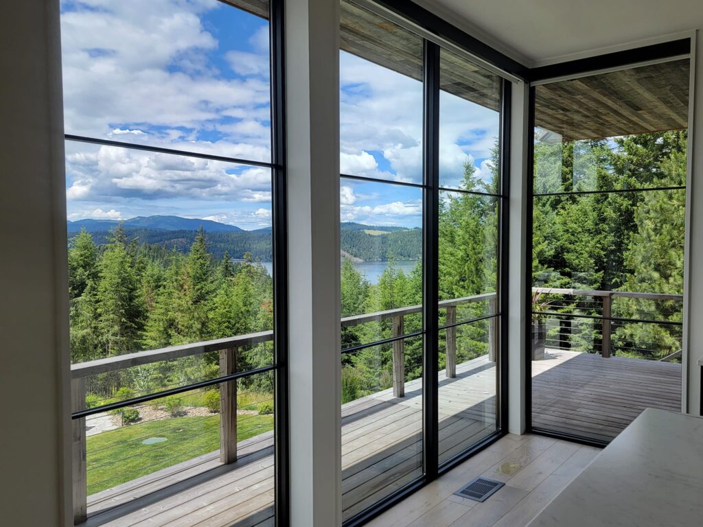 High-end residential window cleaning for a custom home in Rathdrum, ID by Bullseye Wash Systems, providing streak-free windows and spotless results.