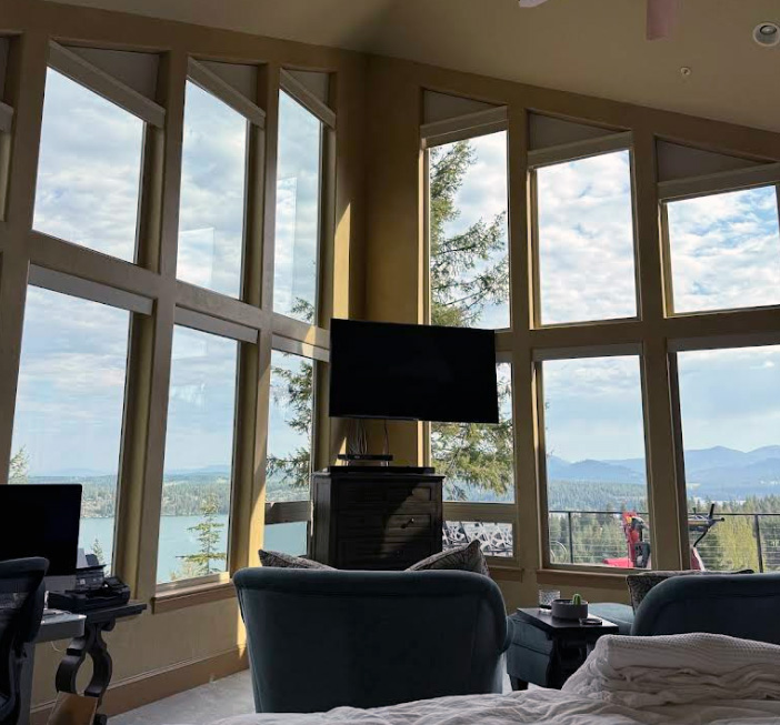Exterior cleaning service for high-end custom home in Fernan Mountain, Coeur d'Alene, ID by Bullseye Wash Systems, including professional window washing for tall windows.