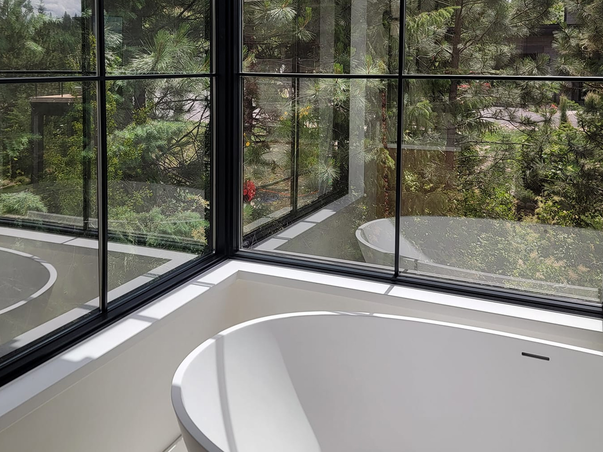 Pressure washing services for the exterior of a home in Bayview, ID by Bullseye Wash Systems.