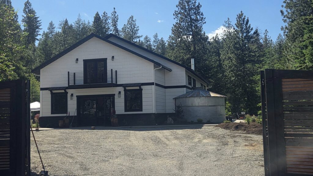 Pressure washing services for the exterior of a home in Spirit Lake, ID, provided by Bullseye Wash Systems.