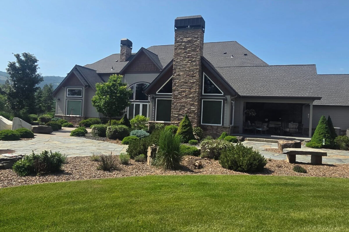 Window washing for a high-end custom home in Spokane, WA by Bullseye Wash Systems, ensuring streak-free windows for clear views.