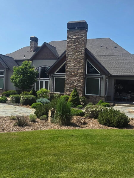 Window washing for a high-end custom home in Spokane, WA by Bullseye Wash Systems, ensuring streak-free windows for clear views.