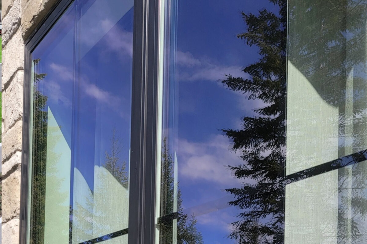 Soft washing services for a luxury home in Rathdrum, ID with views of Vanishing Prairie, provided by Bullseye Wash Systems.