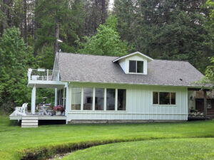 Window cleaning for a lake house short-term rental in Spokane Valley, WA, provided by Bullseye Wash Systems, ensuring a spotless and inviting appearance.