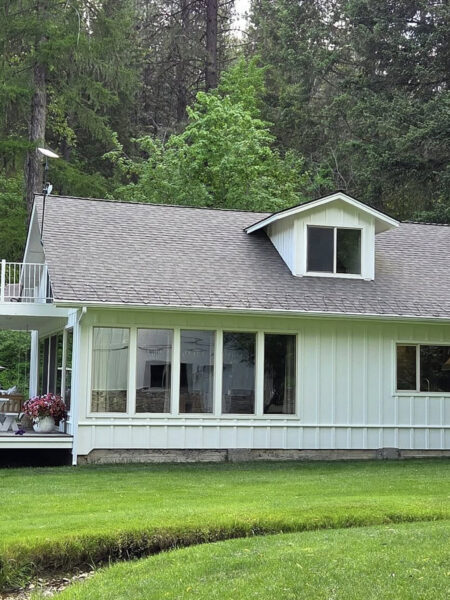 Window cleaning for a lake house short-term rental in Spokane Valley, WA, provided by Bullseye Wash Systems, ensuring a spotless and inviting appearance.