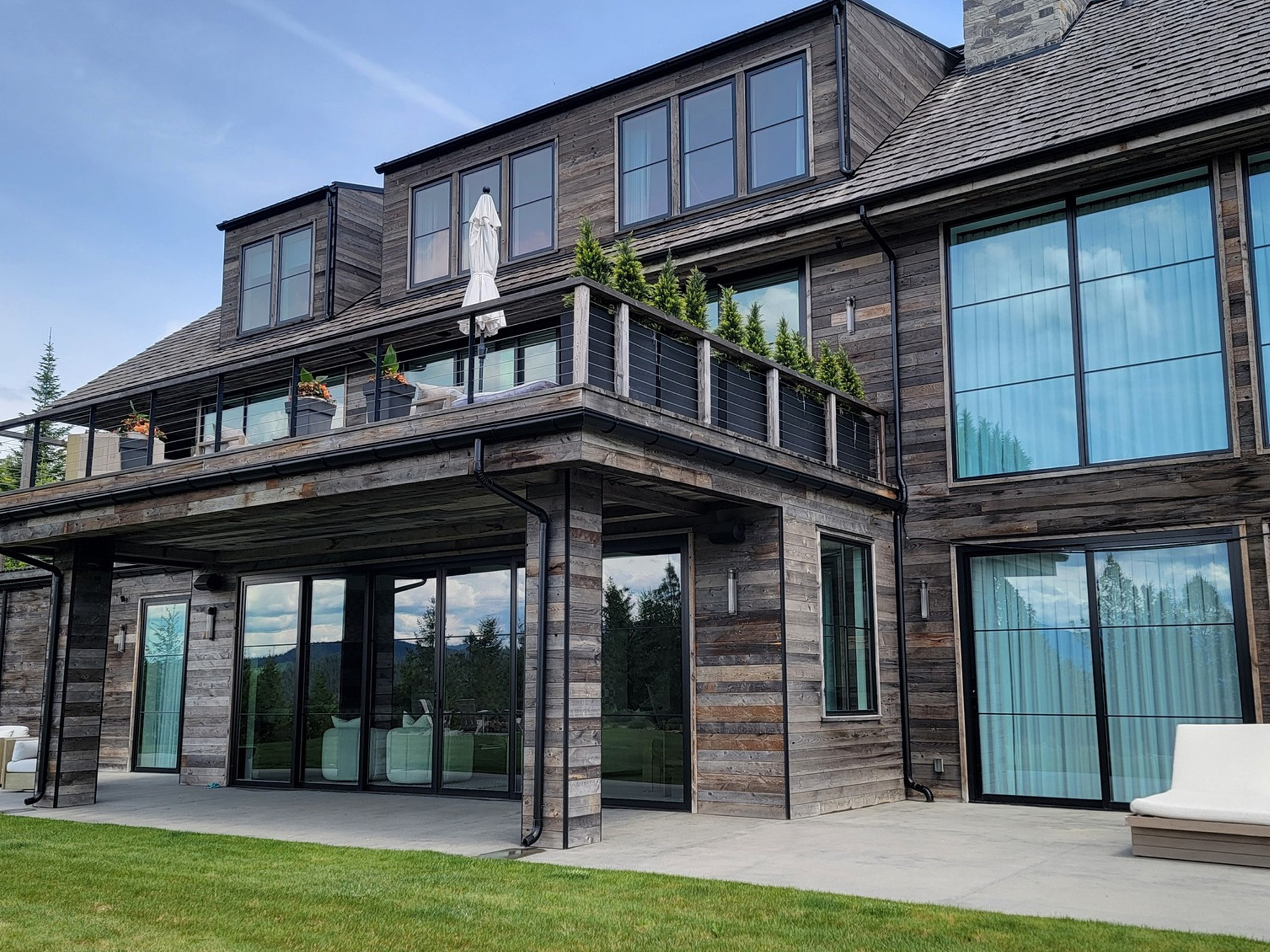Window washing for a high-end custom home in Coeur d'Alene, ID, provided by Bullseye Wash Systems, restoring clarity and shine to your windows.