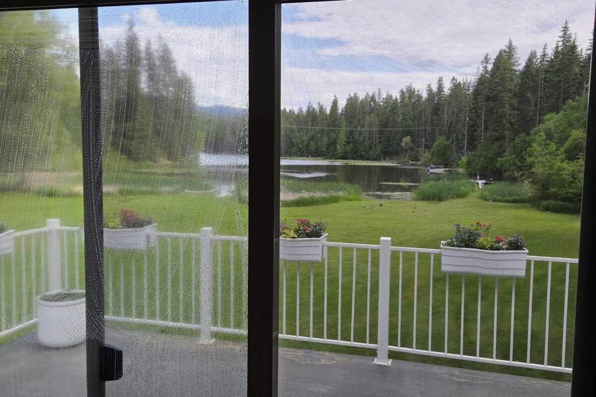 Window washing for a large home in Mead, WA by Bullseye Wash Systems, ensuring clean and streak-free windows for a polished look.