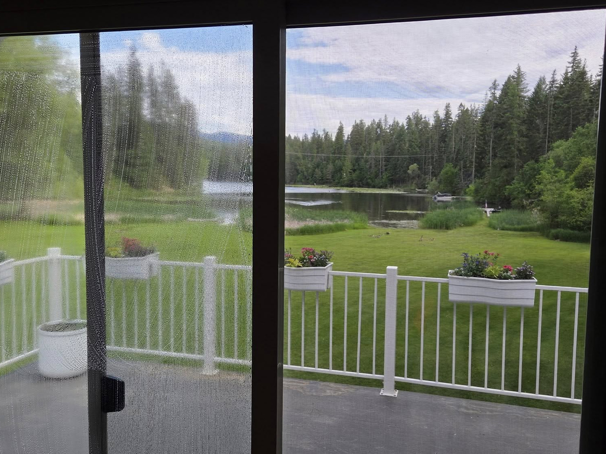 Window washing for a large home in Mead, WA by Bullseye Wash Systems, ensuring clean and streak-free windows for a polished look.