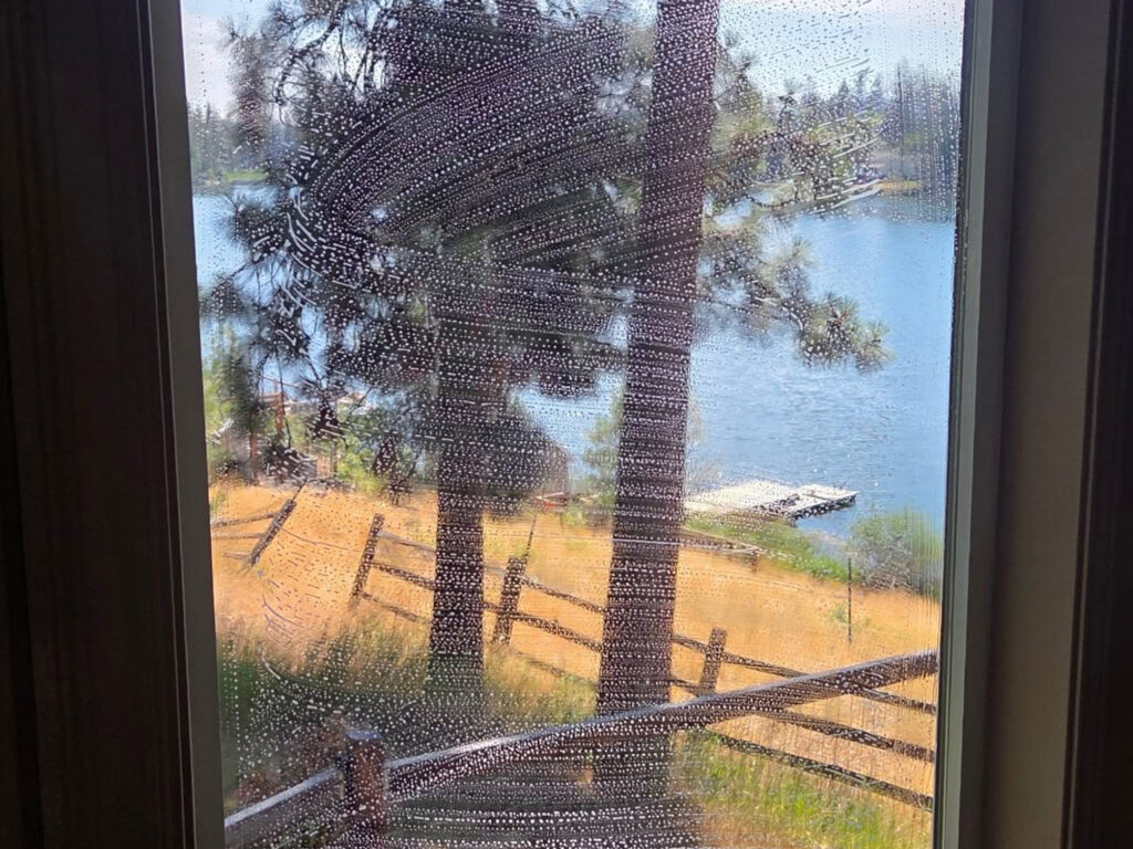 before and after residential window cleaning near Coeur d'Alene Idaho showing glass clarity improvement