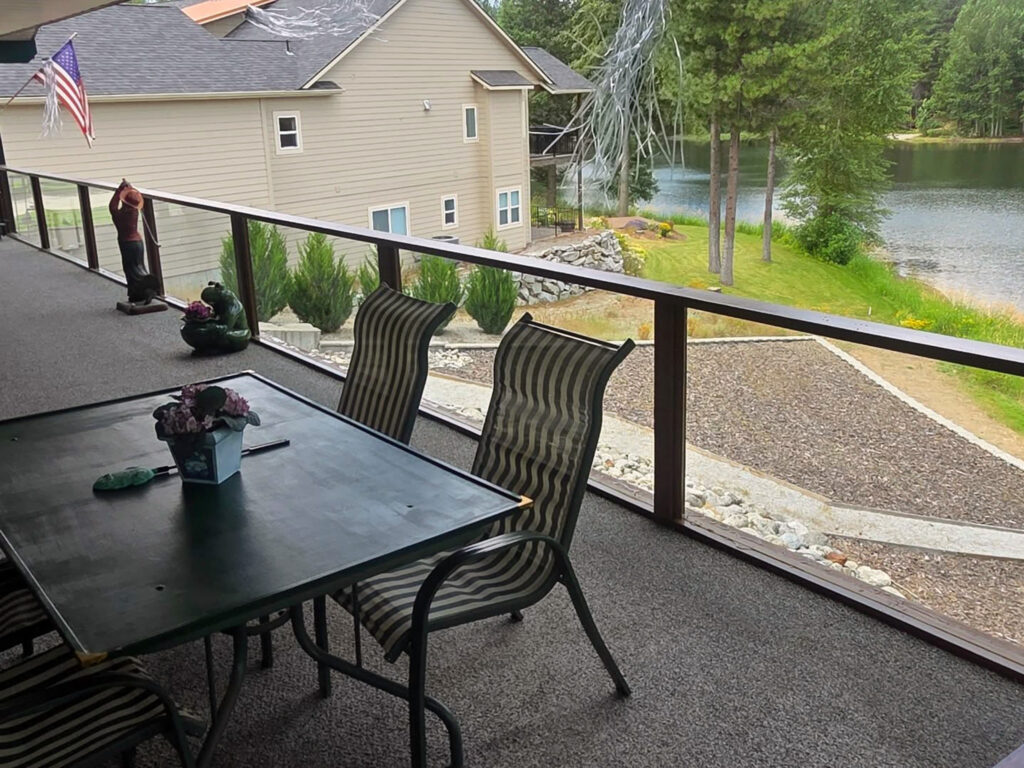 crystal clear resort windows reflecting homes across the lake after commercial window cleaning at StoneRidge Resort