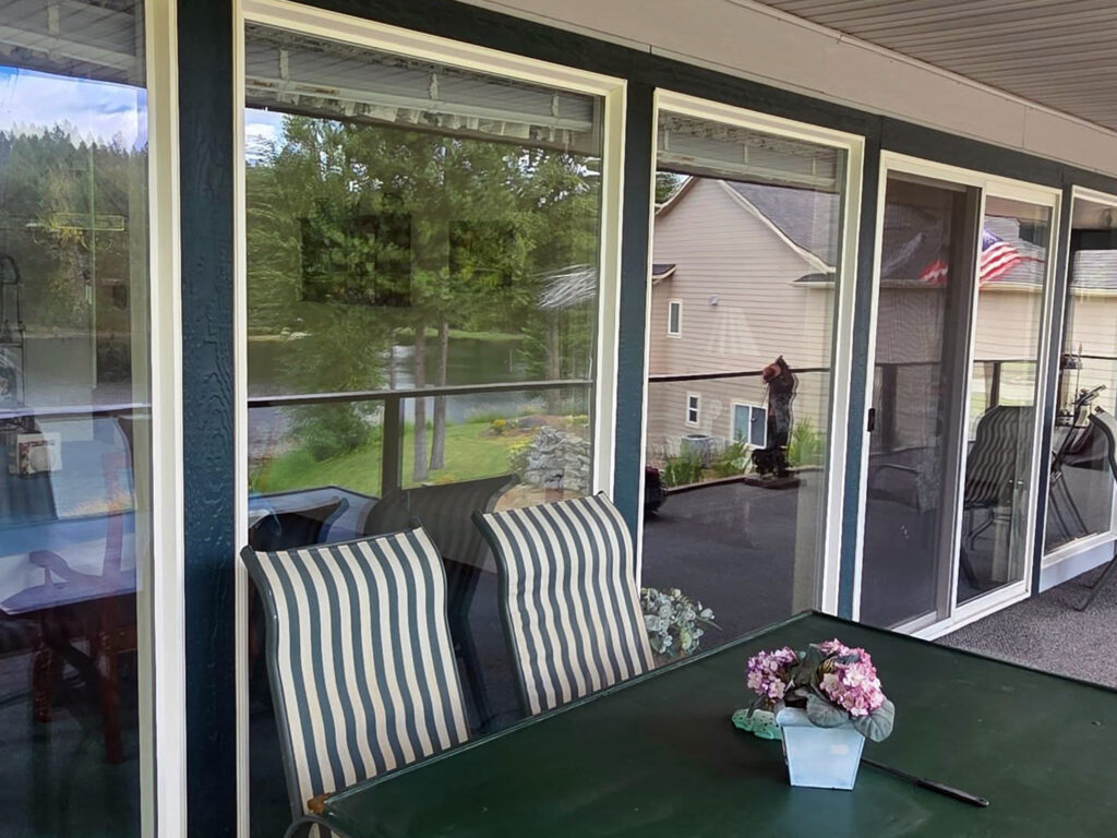 balcony window cleaning showing clear lake views near Athol Idaho after professional window washing